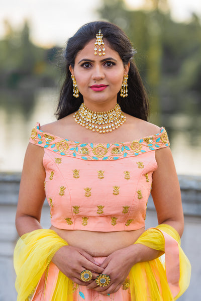 JUHI - Peach Embroidered Lehenga.